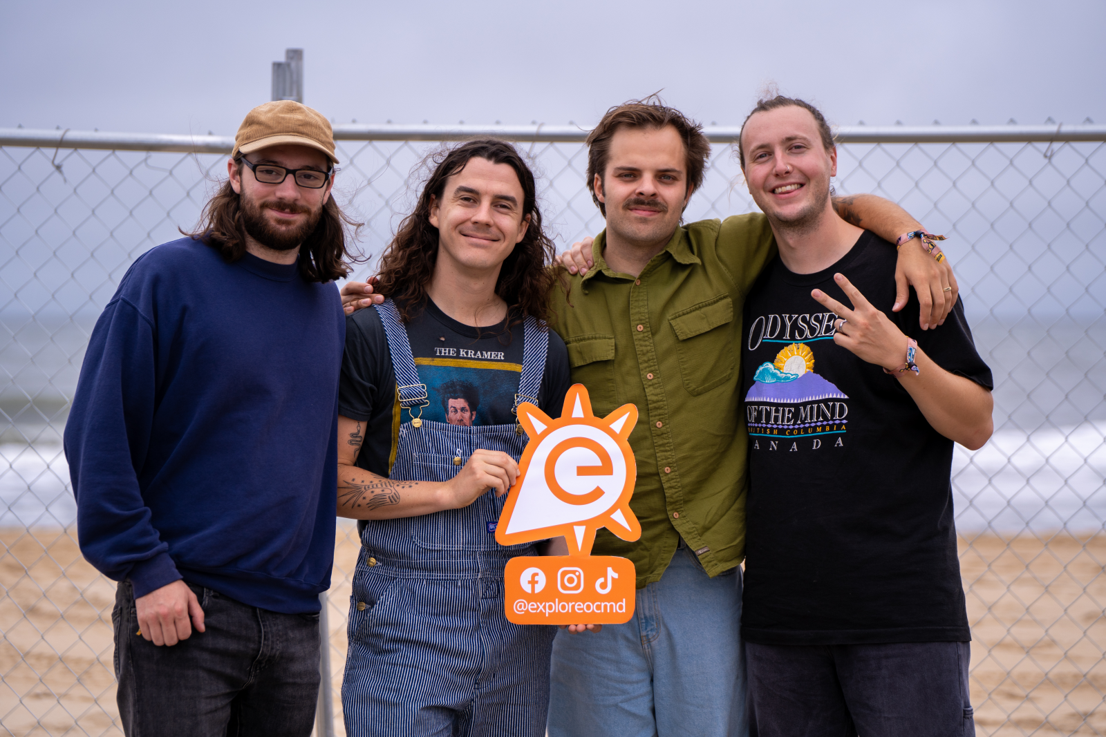 Peach Pit band posing with Explore OC logo
